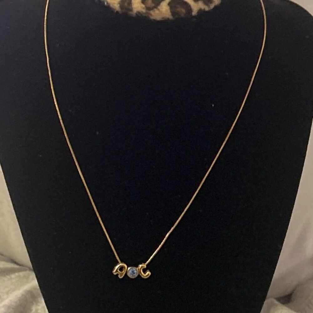 Gold Tone “AOC” Crystal Pendant Necklace